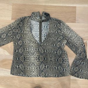 Snakeskin top with high neck detail and bell sleeves